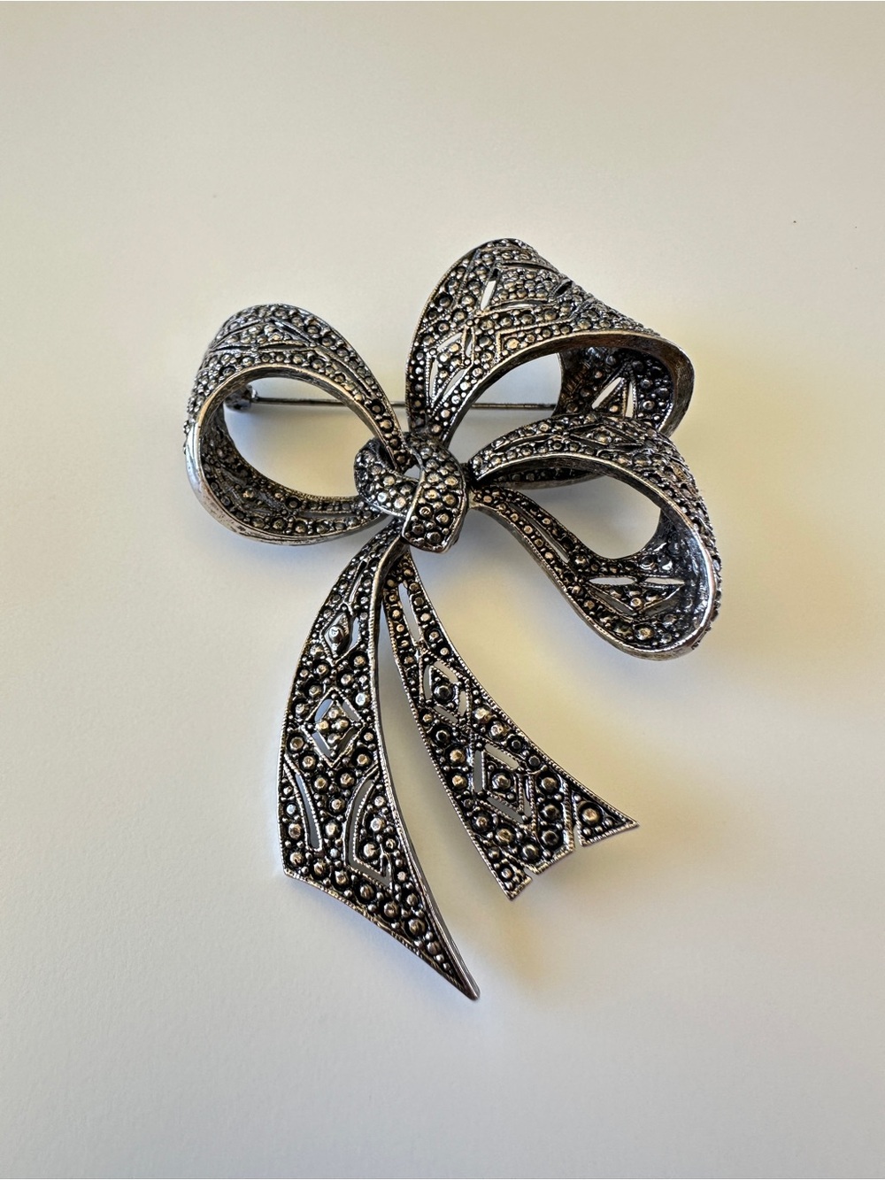 Vintage-Inspired Silver Bow Brooch with Marcasite Detailing